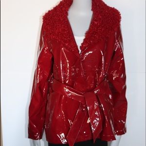 Woman red vinyl jacket with attached collar.